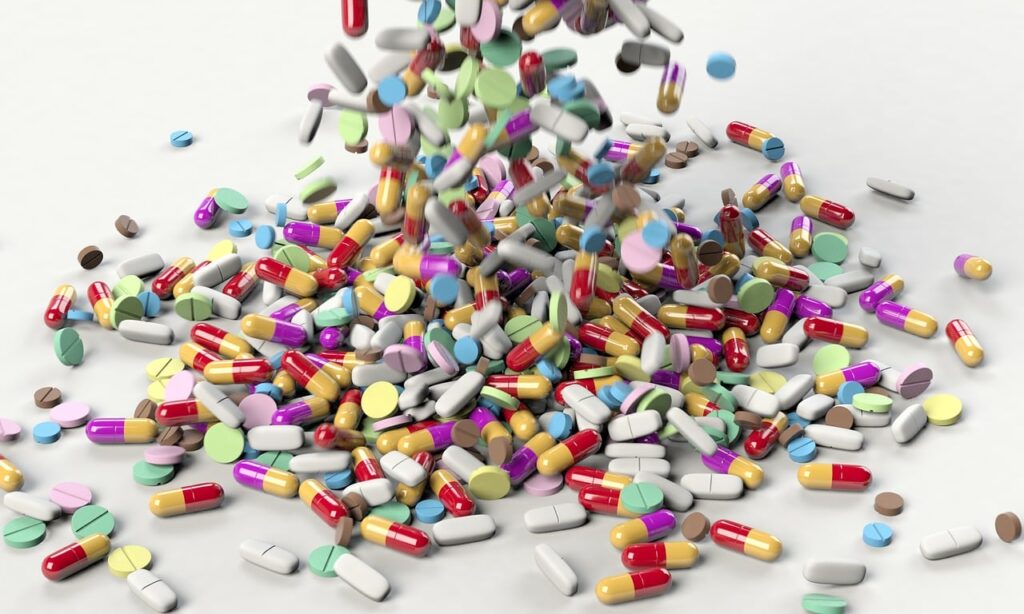 treatment of lupus showing a lot of pills tablets and capsules